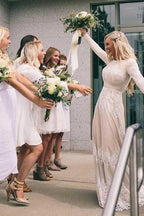 Vestido de novia de tul color marfil, corte línea A, escote barco, mangas largas y apliques WD399