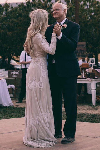 Vestido de novia de tul color marfil, corte línea A, escote barco, mangas largas y apliques WD399