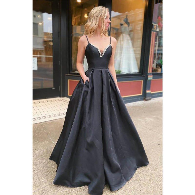 Vestido largo de fiesta de corte A, negro satinado, con escote en V, bordado con cuentas y bolsillos. 