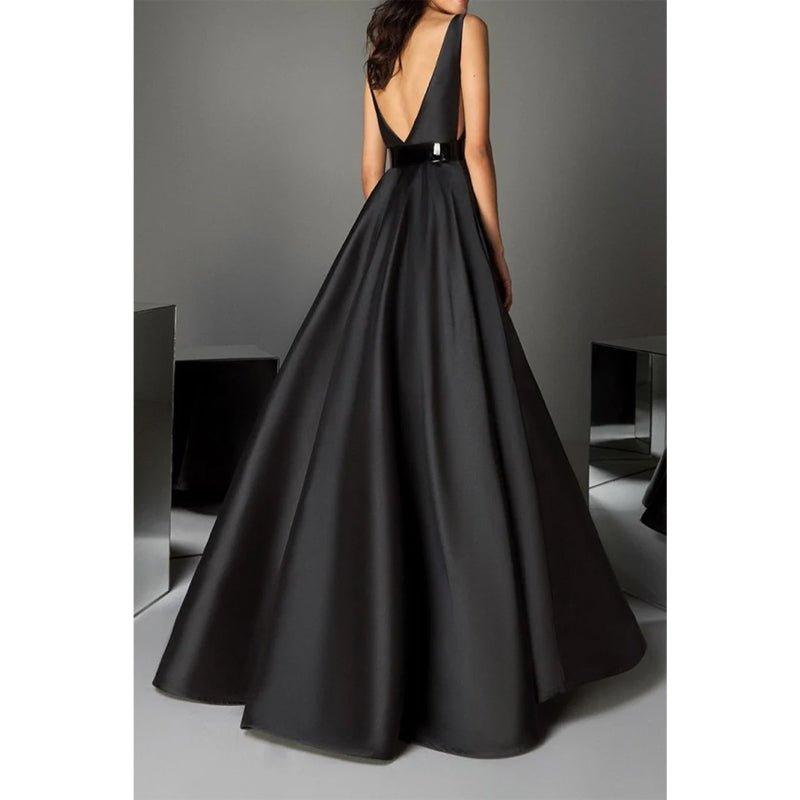 Vestidos de noche largos negros de corte formal, con escote en V profundo, cinturón y bolsillos. 