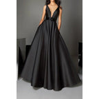 Vestidos de noche largos negros de corte formal, con escote en V profundo, cinturón y bolsillos. 
