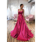 Vestido largo de fiesta corte A con tirantes dobles, abertura y bolsillos 