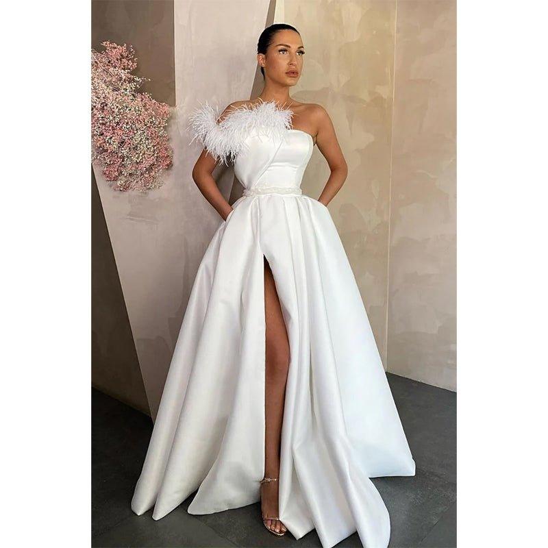 Vestido de fiesta sin tirantes, corte en A, abertura alta y bolsillos 