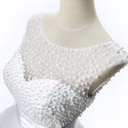 Vestido de fiesta de tul con joyas y corte en A