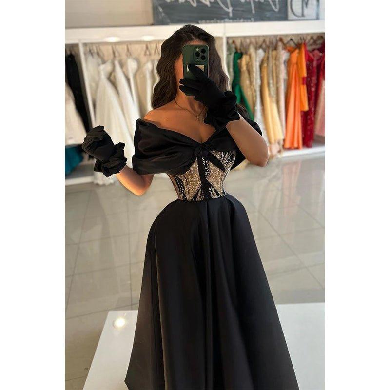 Vestido largo de fiesta de satén con corte en A, hombros descubiertos y cintura con cuentas. 
