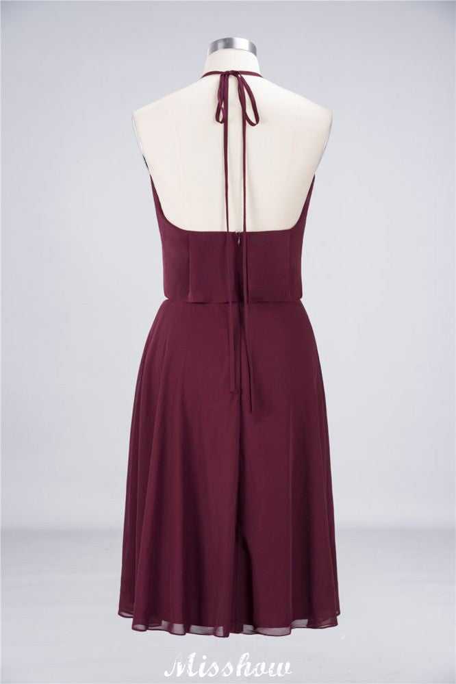 Vestido de fiesta sencillo de corte A, con volantes, de gasa y cuello halter hasta la rodilla.