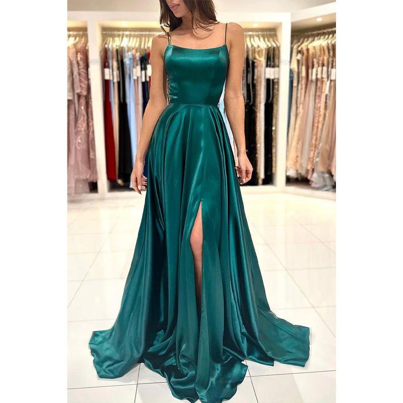 Vestido largo de fiesta sencillo, de corte línea A, con escote redondo, abertura alta y bolsillos.