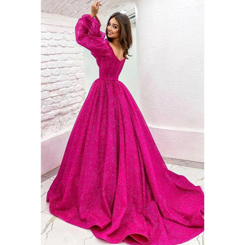 Vestido de fiesta fucsia brillante de corte línea A con escote redondo, mangas largas y bolsillos. 