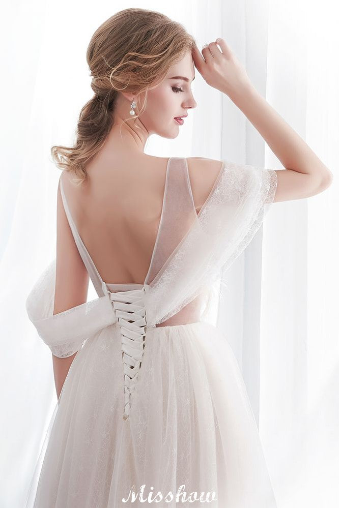 Robe de mariée ivoire en dentelle, coupe trapèze, sans manches, longueur au sol, coupe trapèze.