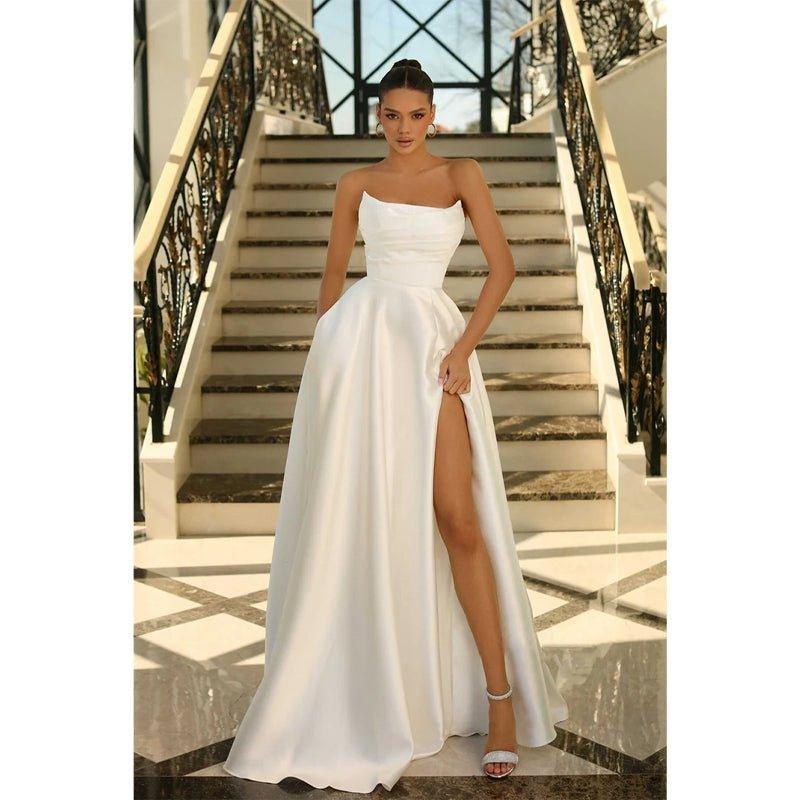 Vestido largo de fiesta formal de satén sin tirantes, corte en A, con pliegues y bolsillos. 