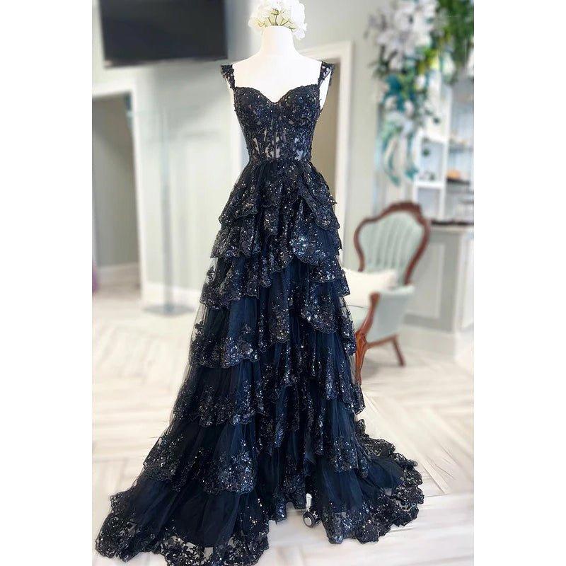Vestido de fiesta sin mangas con tirantes, tul, apliques y lentejuelas, cierre de cremallera y corte en A