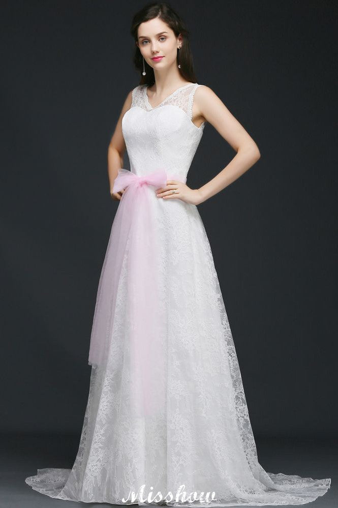Vestido de novia blanco de corte A con tirantes y lazo.