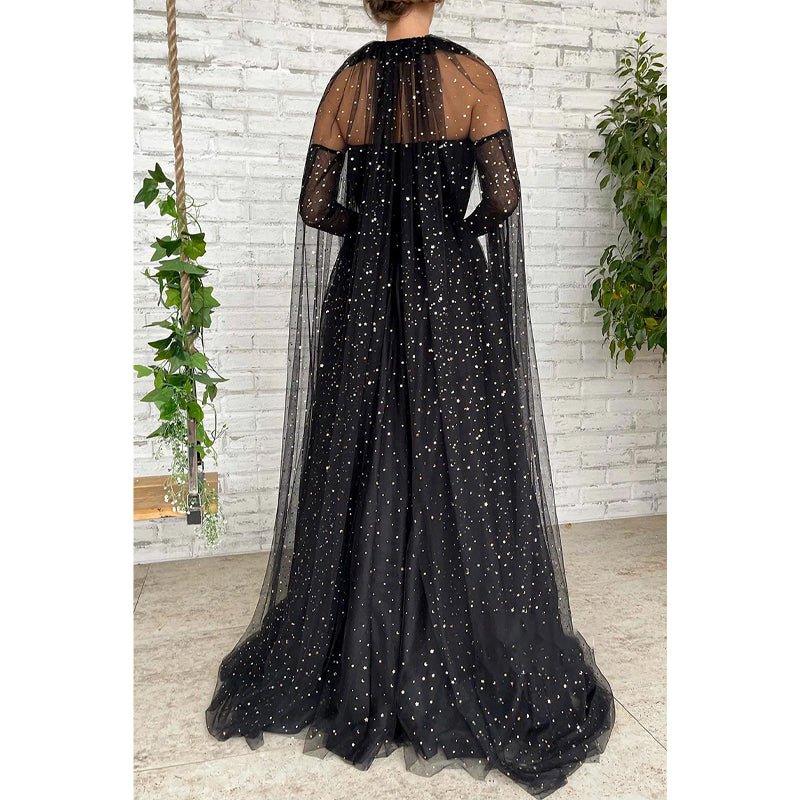 Vestido largo de fiesta negro de tul con escote corazón y estrella, corte en A y brillo.