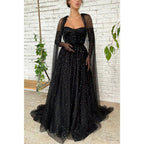 Vestido largo de fiesta negro de tul con escote corazón y estrella, corte en A y brillo.
