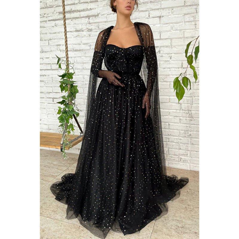 Vestido largo de fiesta negro de tul con escote corazón y estrella, corte en A y brillo.