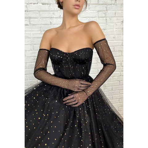 Vestido largo de fiesta negro de tul con escote corazón y estrella, corte en A y brillo.