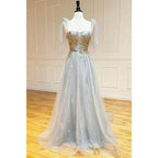 Vestido largo de fiesta corte A con escote corazón y apliques bordados. 