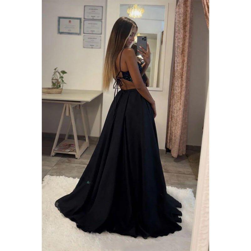 Vestido largo de fiesta brillante con escote corazón, corte en A, top de lentejuelas y abertura.