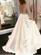 Vestidos de novia de corte A, escote en V, corpiño transparente, mangas largas con cuentas WD454