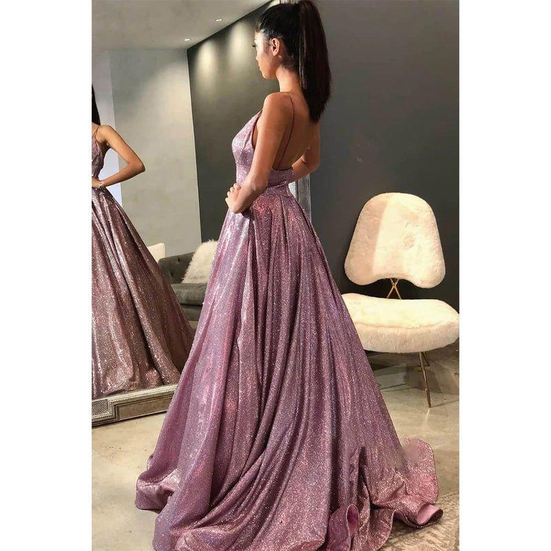 Vestido de fiesta brillante con escote en V, tirantes finos y bolsillos. 