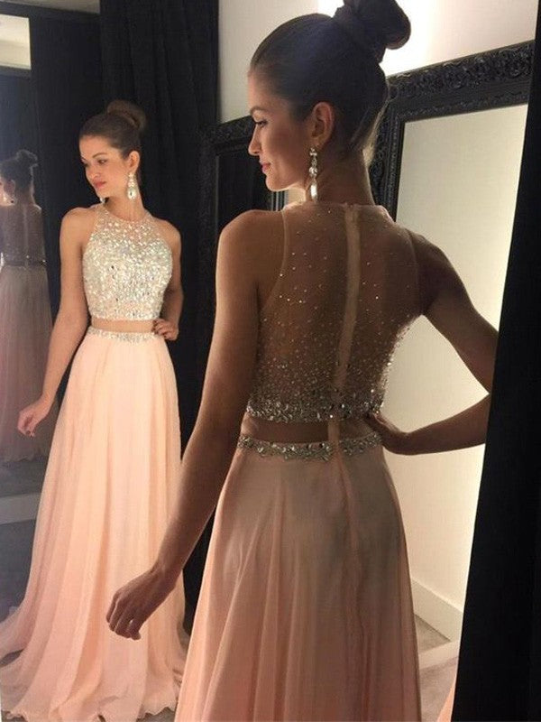 Vestidos de graduación de gasa con escote redondo, corte en A/elegantes, sin mangas, con cuentas y corte favorecedor.