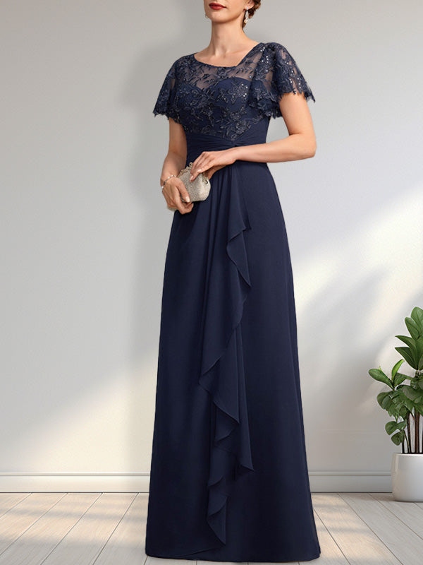 Vestido de novia de corte asimétrico, ilusión, largo hasta el suelo, de encaje y gasa, con cascada de volantes y lentejuelas. 