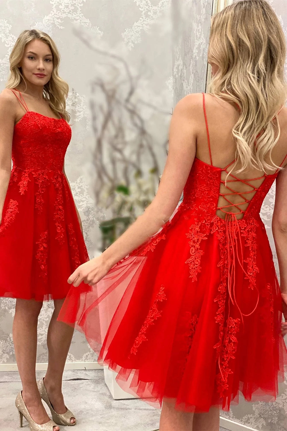 Robe de bal courte à fines bretelles ornée d'appliqués