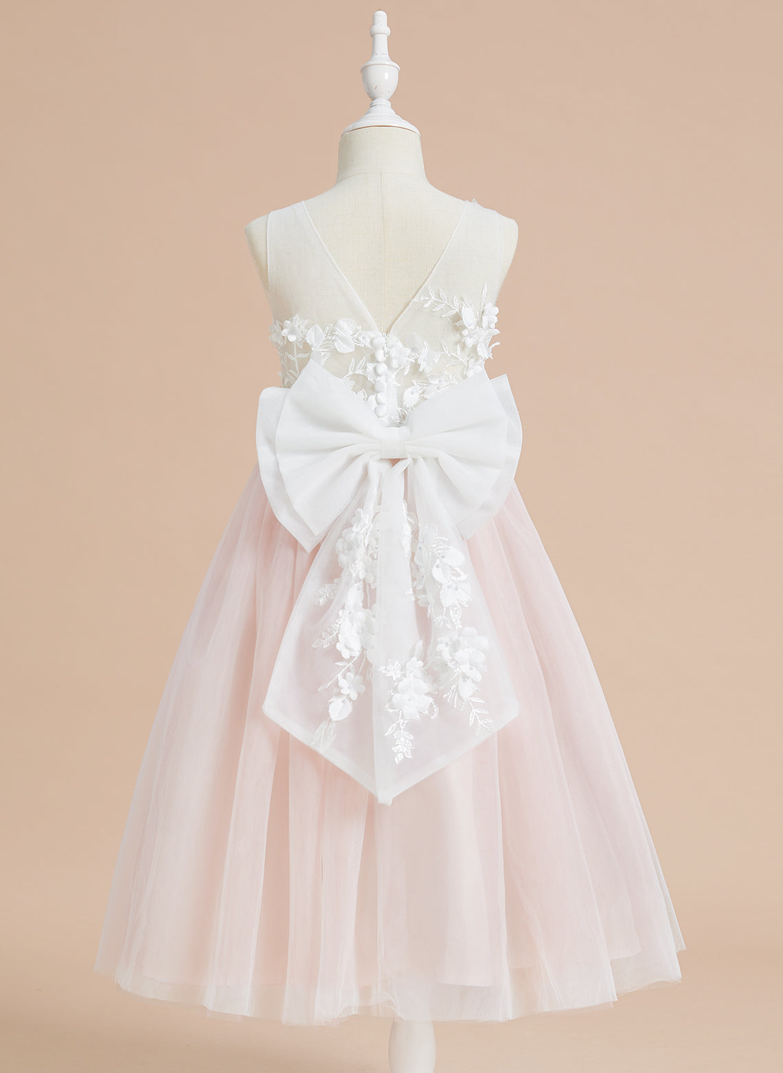 Vestido midi de encaje floral y lazo grande 