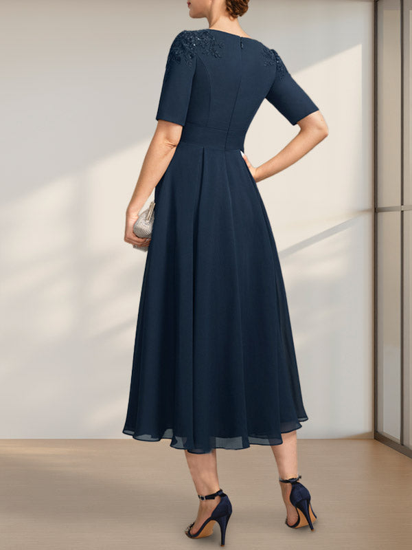 Vestido de corte A, escote redondo, largo té, de gasa, para la madre de la novia, con apliques de encaje y lentejuelas.