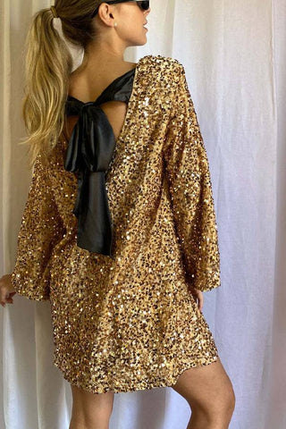 Robe mini ample à paillettes et nœud dans le dos, idéale pour danser toute la nuit 