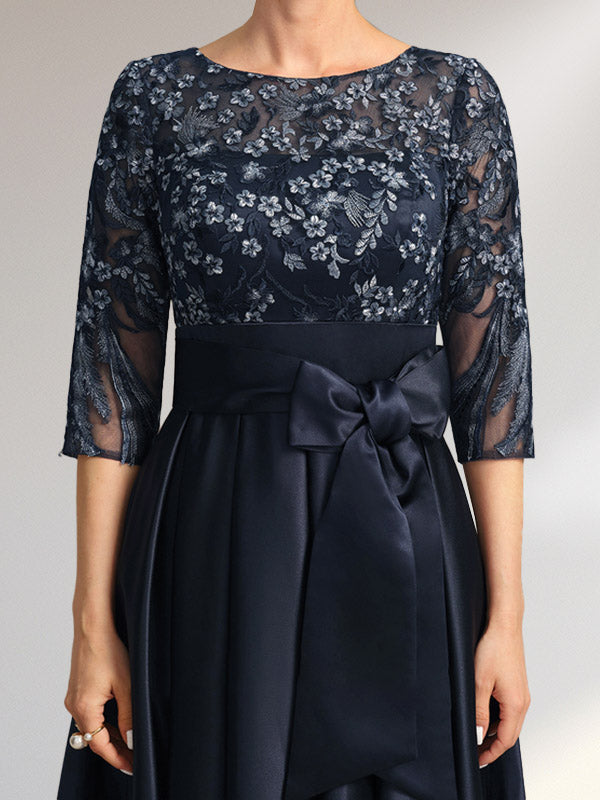 Vestido de madrina de la novia, corte asimétrico, escote ilusión, satén y encaje, con lazo.