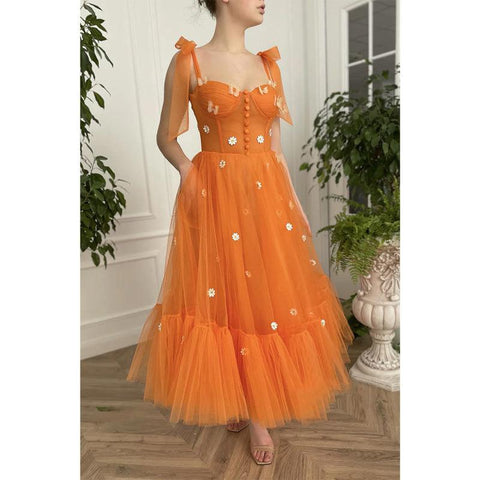 Robe de bal longue trapèze à bretelles spaghetti et décolleté en cœur avec poches 