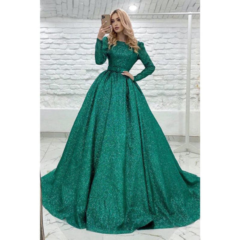 Vestido de fiesta verde con mangas largas y joya única con purpurina