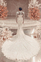 Impresionante vestido de novia largo blanco de encaje columna, cuello alto, manga larga y apliques con cola