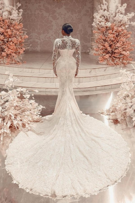 Impresionante vestido de novia largo blanco de encaje columna, cuello alto, manga larga y apliques con cola