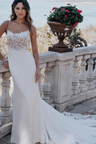 Magnifique robe de mariée blanche sans manches à col en dentelle et décolleté plongeant, ornée d'appliqués