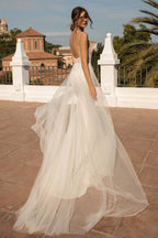 Impresionante vestido de novia largo de sirena con cola de capilla, tul y espalda descubierta