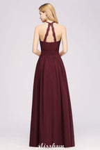 Vestido largo de noche de gasa con apliques, cuello halter, sin mangas y largo hasta el suelo, con volantes y corte en A.