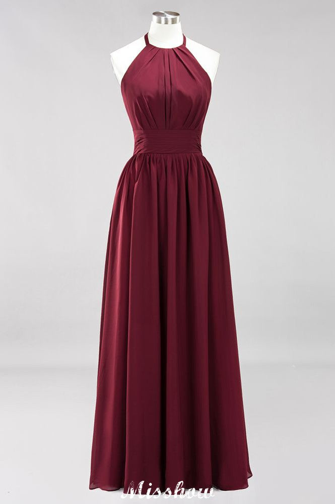 Vestido largo de noche de gasa con apliques, cuello halter, sin mangas y largo hasta el suelo, con volantes y corte en A.