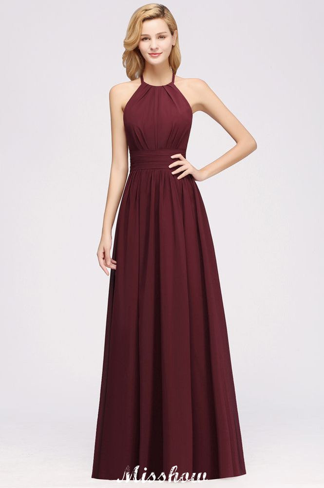 Vestido largo de noche de gasa con apliques, cuello halter, sin mangas y largo hasta el suelo, con volantes y corte en A.