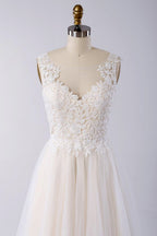 Impresionante vestido de novia largo de corte A con apliques, encaje, tul y espalda descubierta