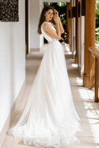 Magnifique robe de mariée longue trapèze en tulle ornée de perles et dos nu