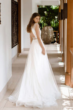 Magnifique robe de mariée longue trapèze en tulle ornée de perles et dos nu