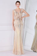 Robe de bal fourreau à sequins dorés et franges