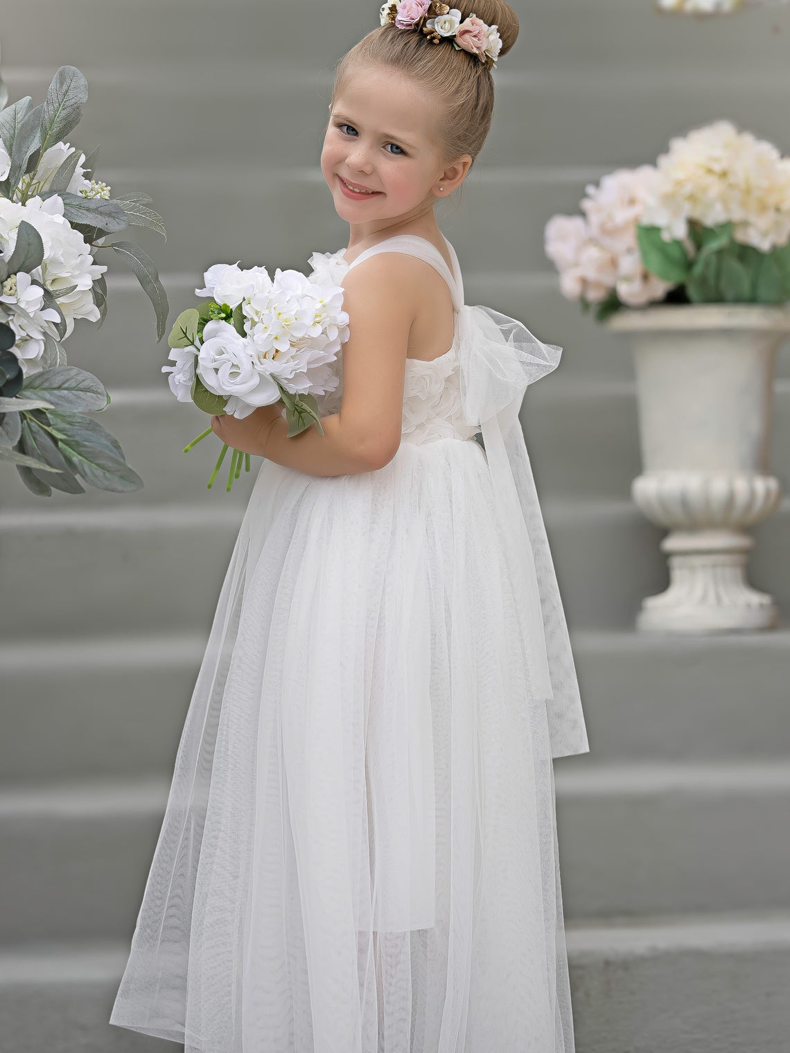 Vestido de bebé niña con lazo de tul y aplique floral en 3D de la colección Jardín Encantado 