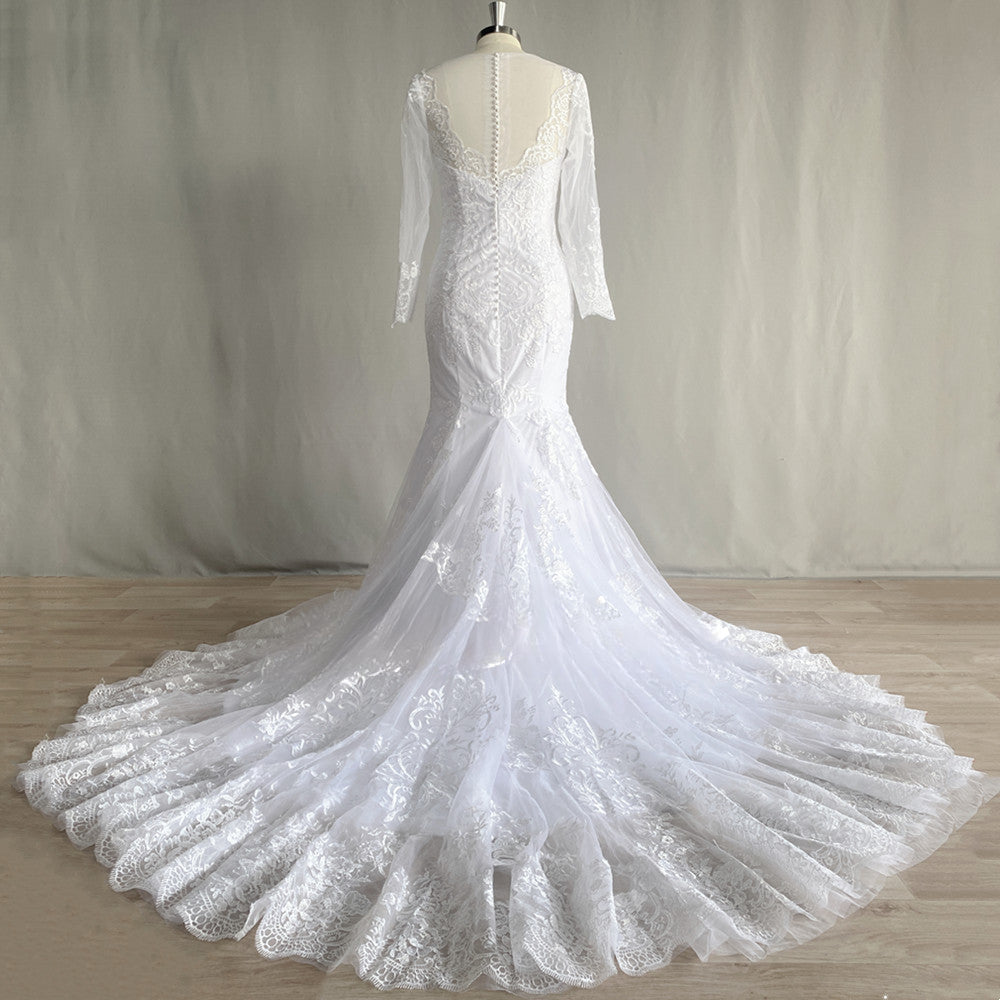 Precioso vestido de novia de sirena de encaje de manga larga, con tul, cola catedral, escote en V, apliques y espalda abotonada. 