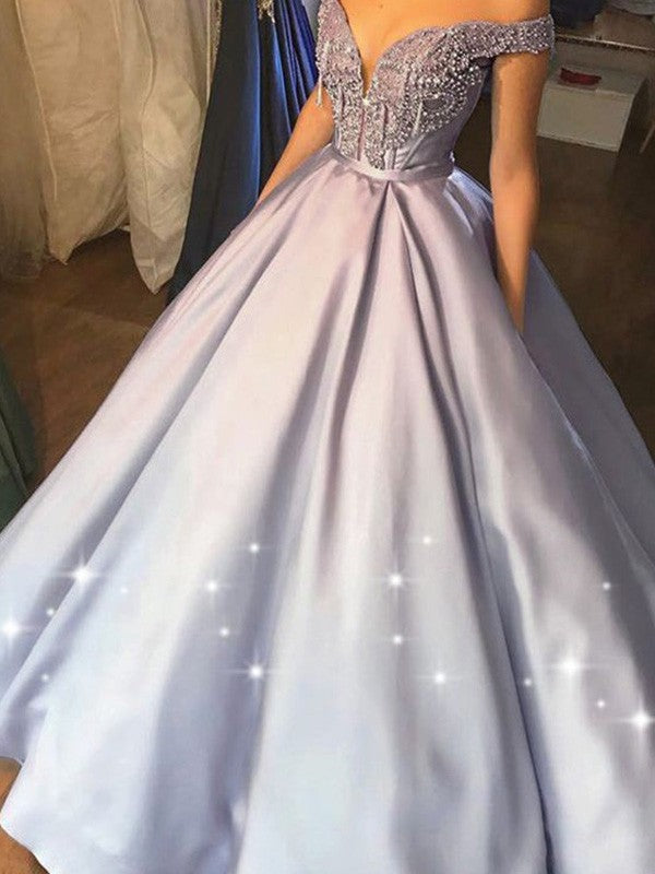 Robe de bal longue sans manches, en satin, ornée de perles et à épaules dénudées