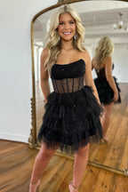 Robe de bal bustier en tulle à volants et corset à sequins