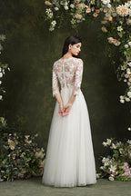 Robe de mariée longue en mousseline et dentelle, coupe trapèze, décolleté cœur et manches, Biztunnel
