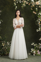 Robe de mariée longue en mousseline et dentelle, coupe trapèze, décolleté cœur et manches, Biztunnel